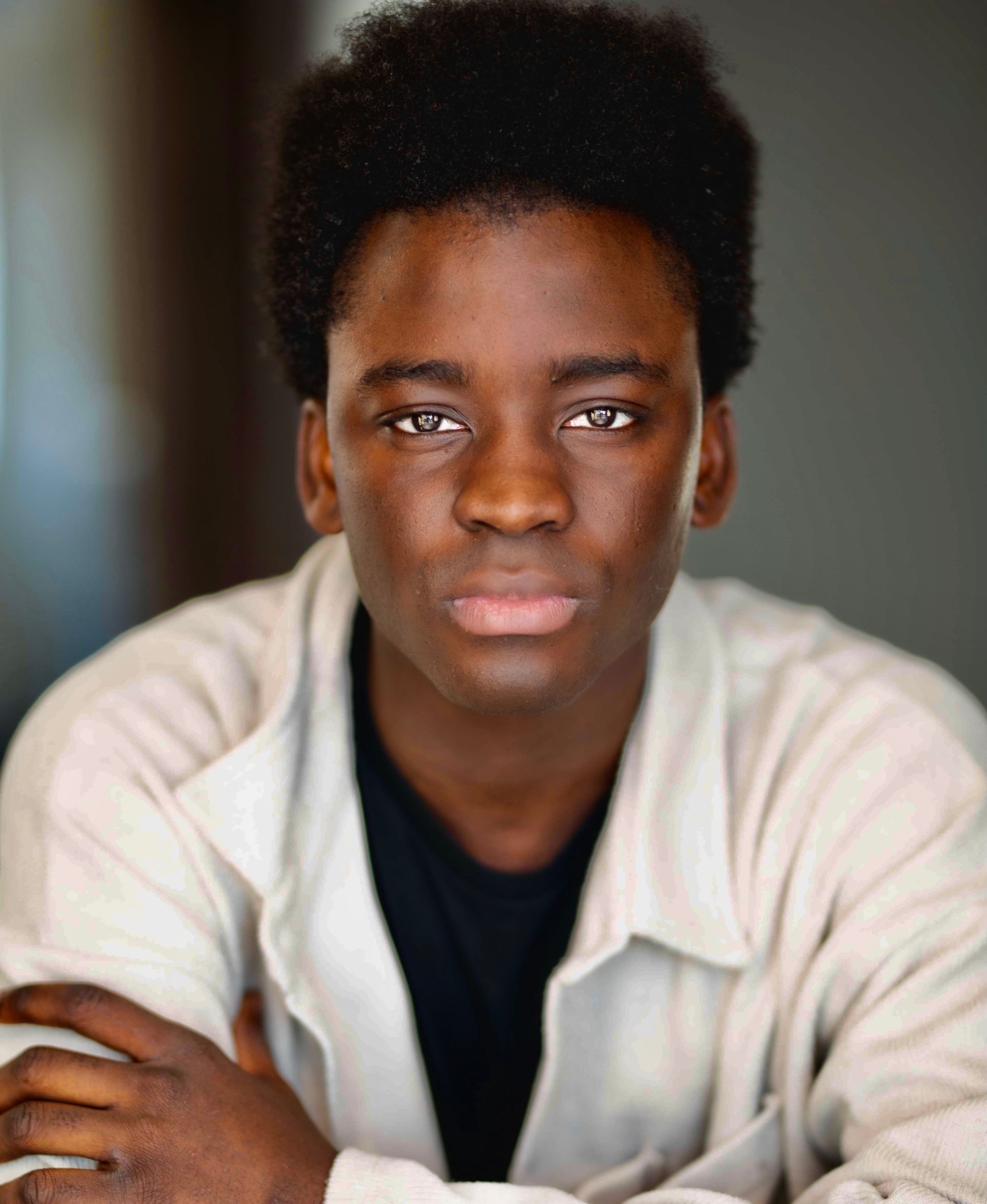 Founder wearing a light-colored jacket with a neutral background